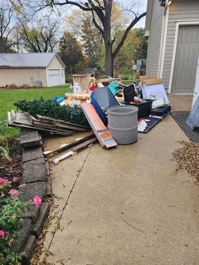 Dumpster being loaded with debris for 30 Yard Dumpster Rental in Readington